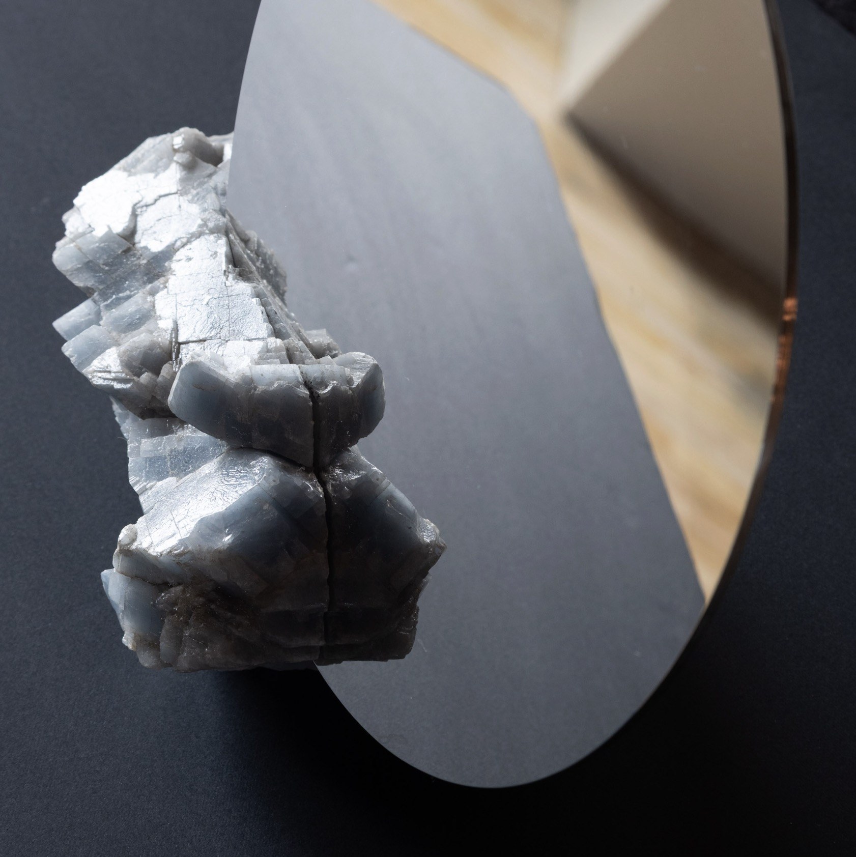 Blue calcite against a polished mirror
