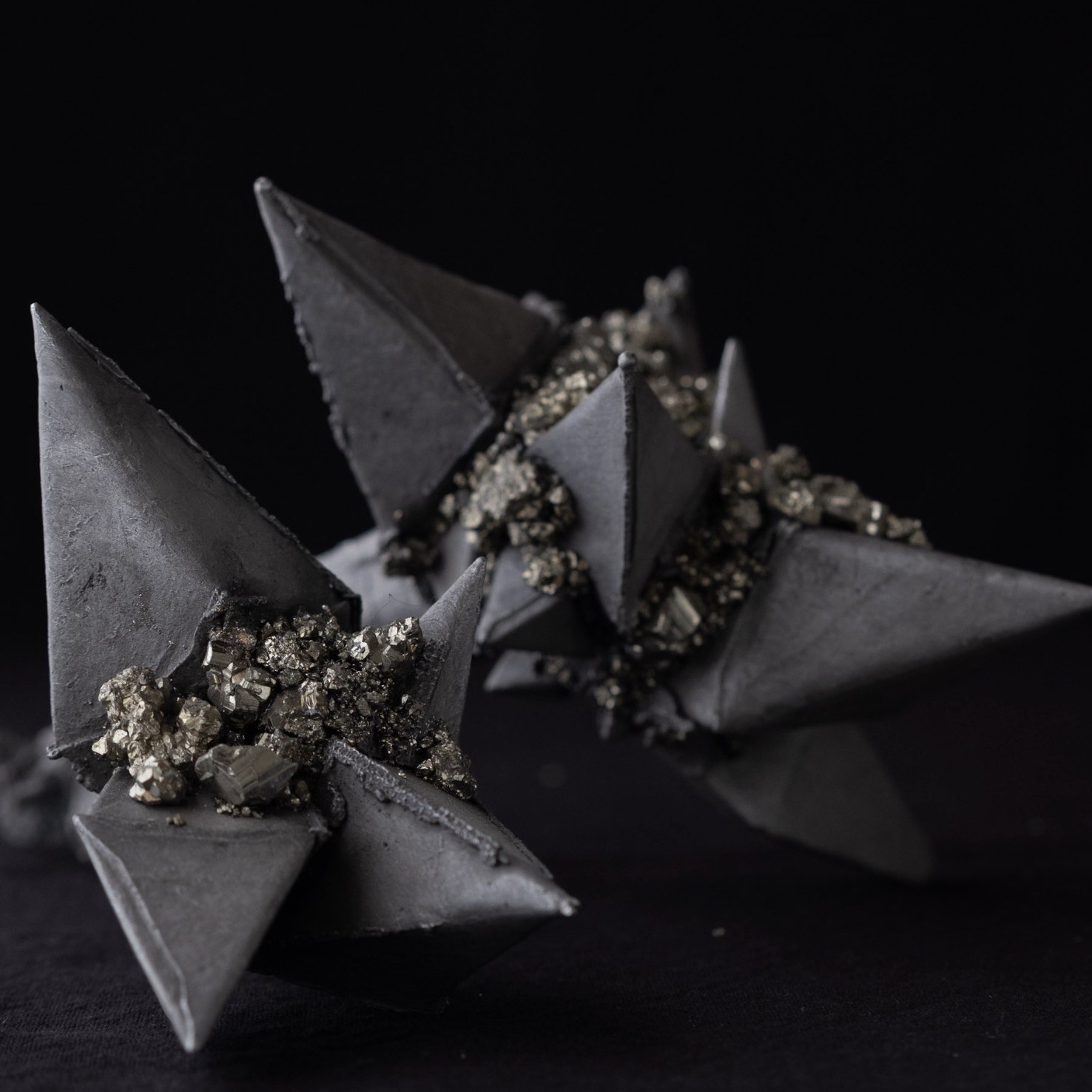 The Weight of Glimmer, seamed with raw pyrite